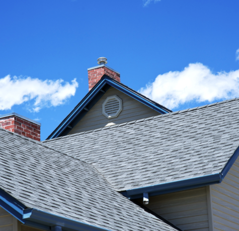 grey shingle roof with blue gutters recently installed